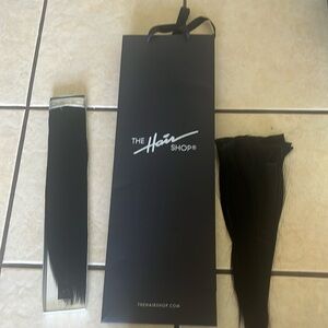 2 packs of 14 inch weft hair extensions. One pack is cut.